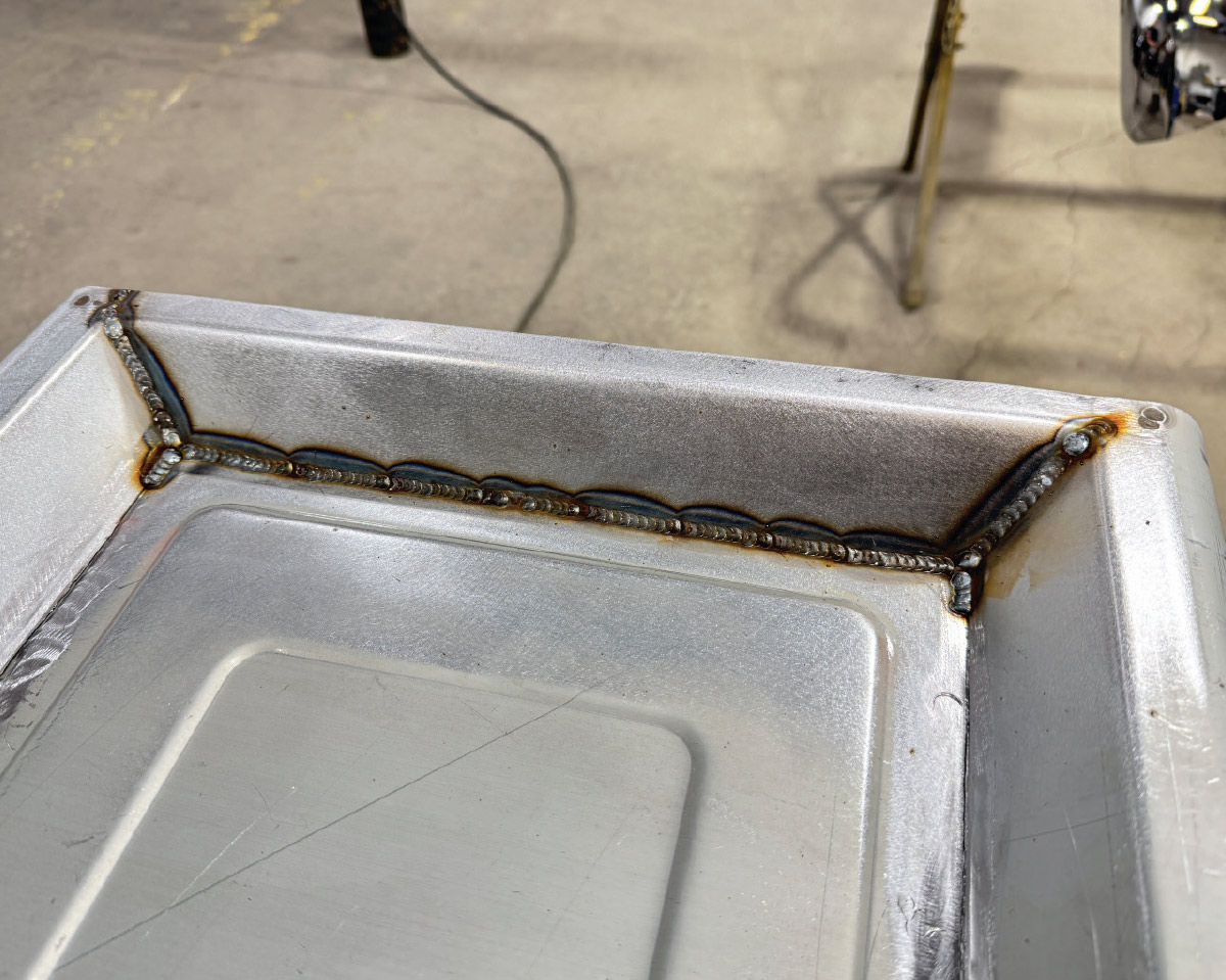 Finished inner-edge bead, uniform scallops, clean panel, grind marks