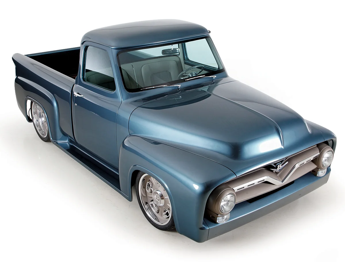 Three-quarter view of a metallic blue custom 1950s pickup truck