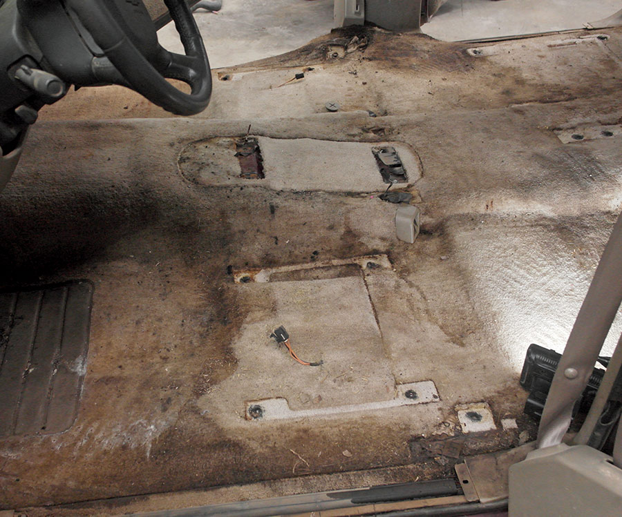 1995 Chevrolet Suburban stripped interior worn carpet seat mounts