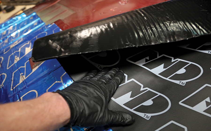 1995 Chevrolet Suburban installing second-layer NDP sound barrier over Noico base
