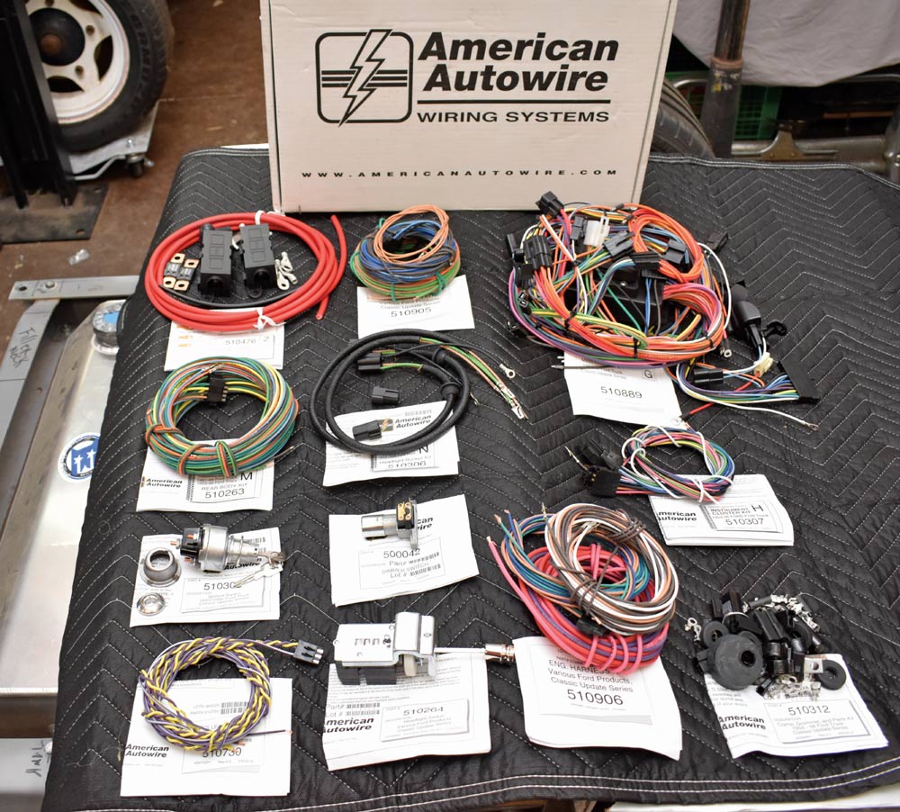 American Autowire standalone engine harness and ECU layout on workbench