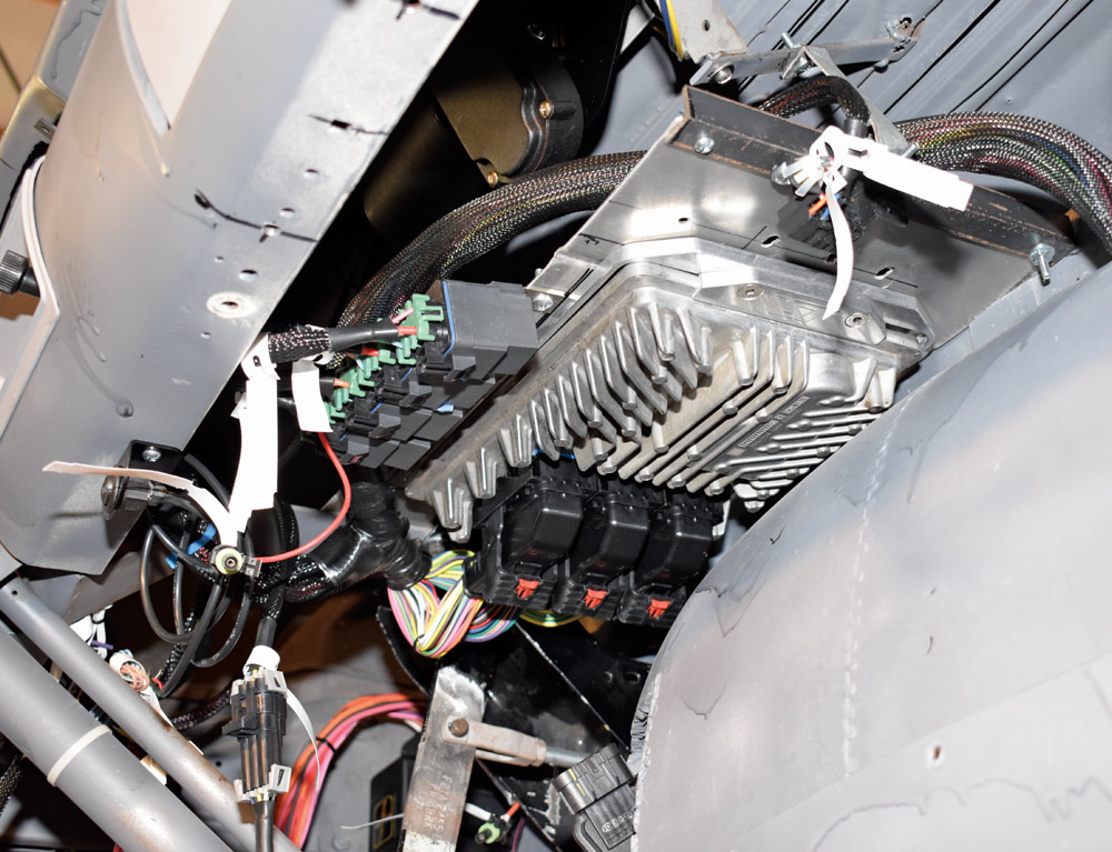 American Autowire ECU and fuse block mounted under dash with harness neatly routed