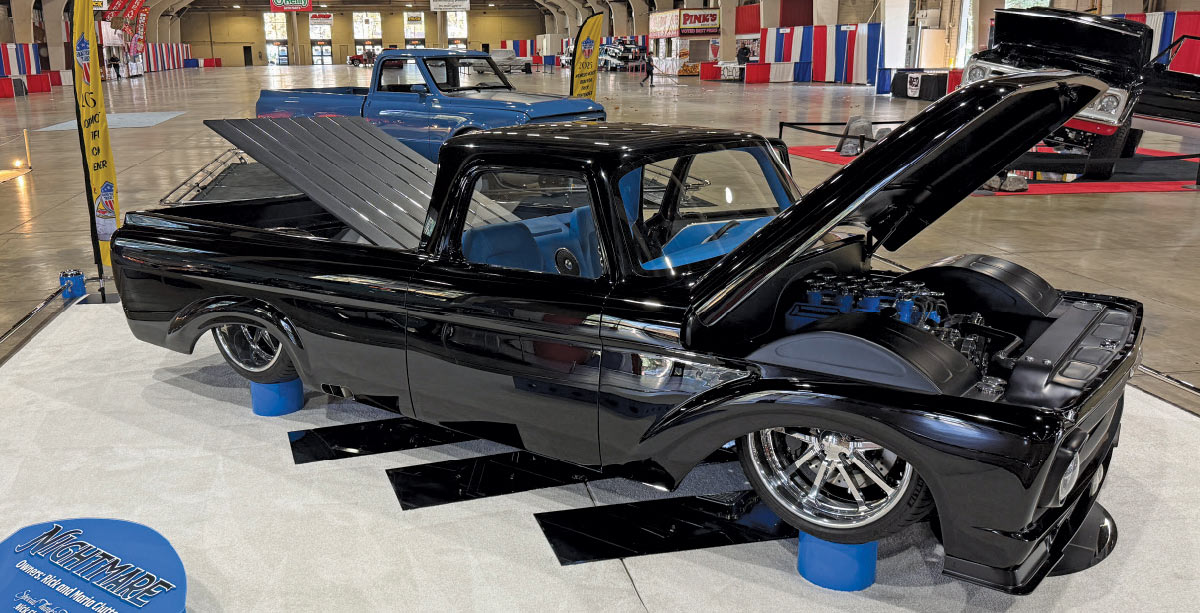 1961 Ford F-100 black custom build “Nightmare” with blue engine bay
