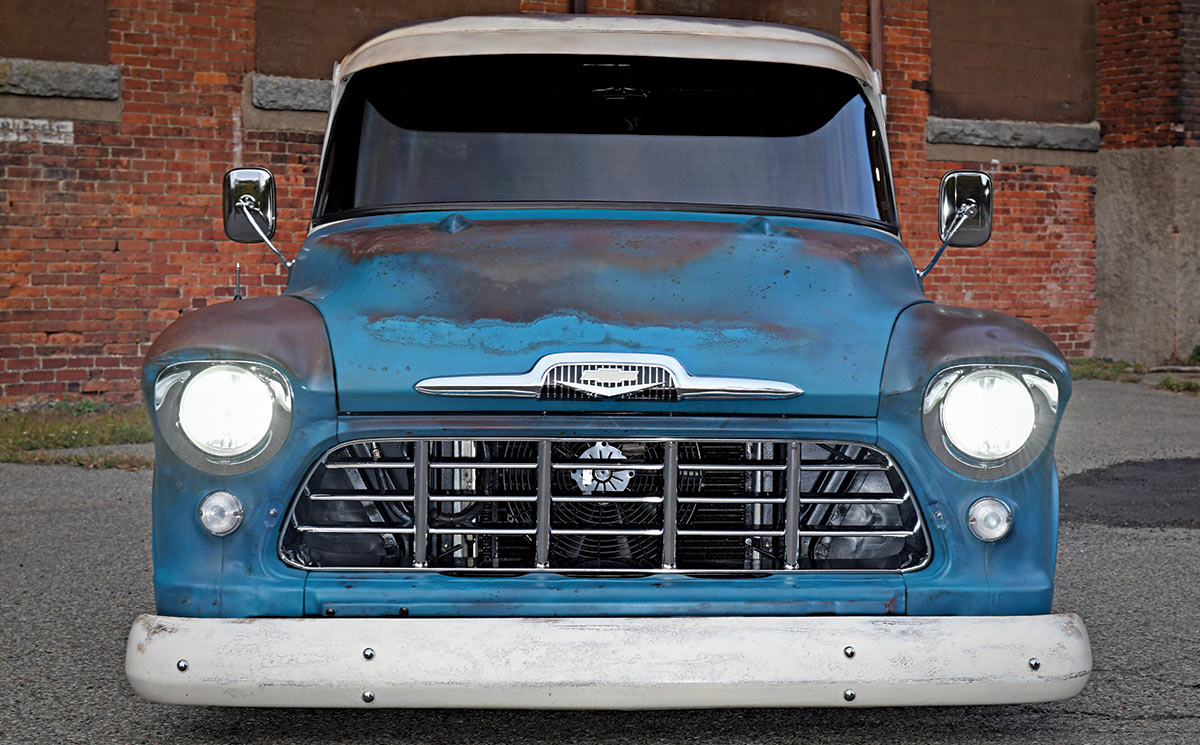 1957 Chevy 3100 front view patina headlights on chrome grille