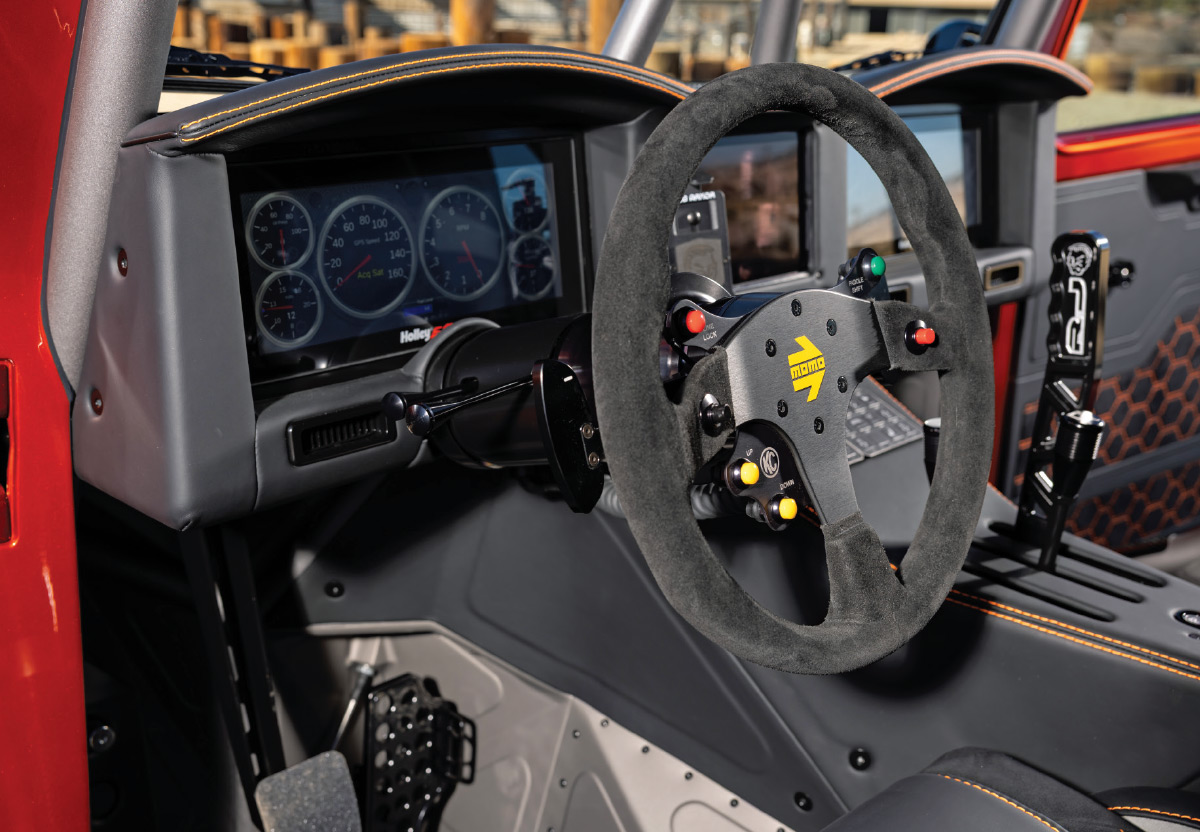 1949 Willys interior featuring MOMO suede racing wheel and digital dashboard with custom controls