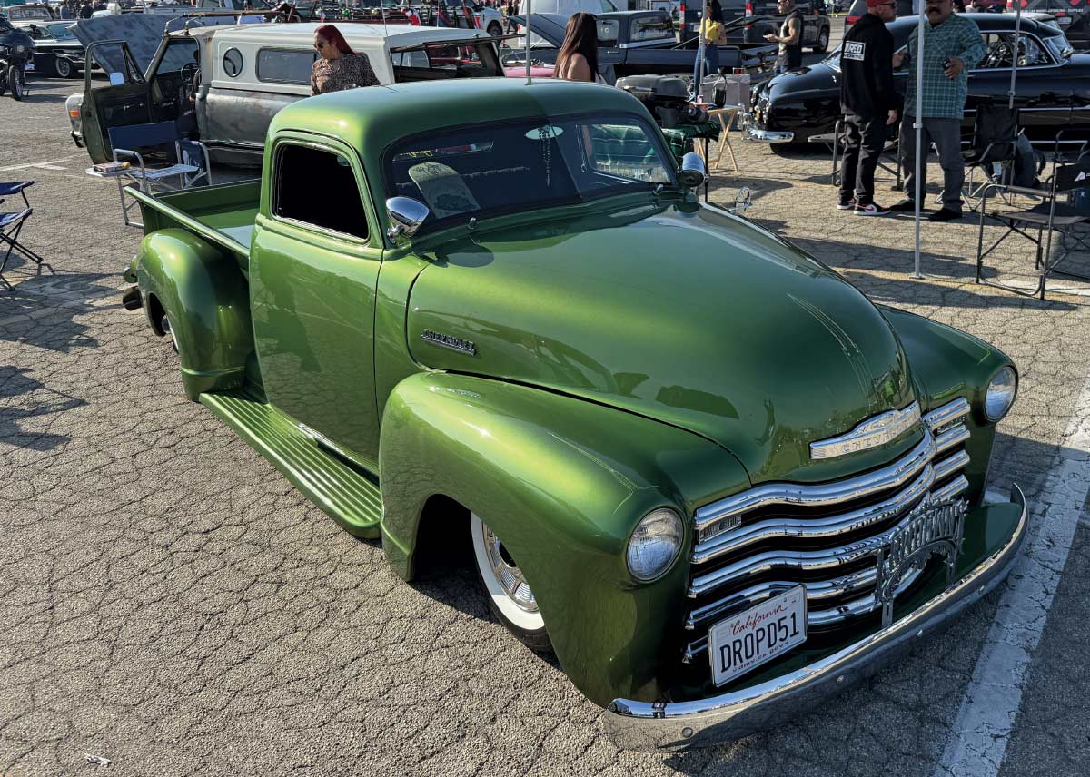 1951 Chevrolet 3100 custom metallic green lowered pickup truck classic car show parking lot display