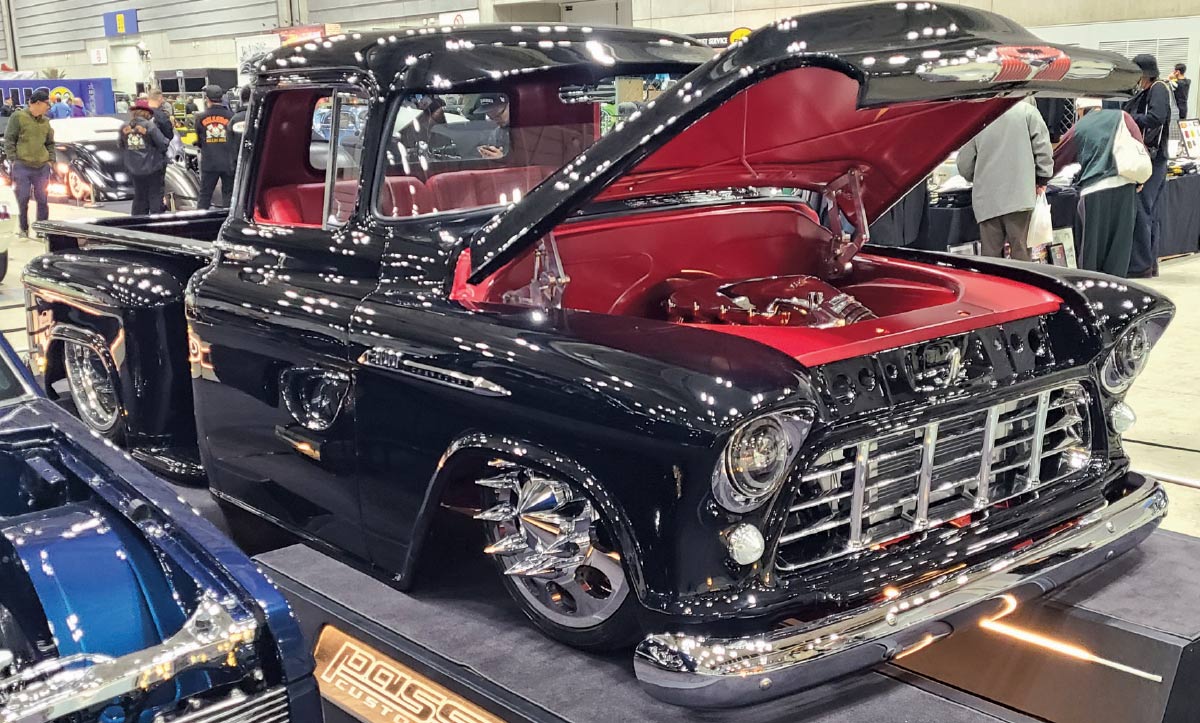 1956 Chevrolet 3100 custom black and red show truck shaved hood open engine bay