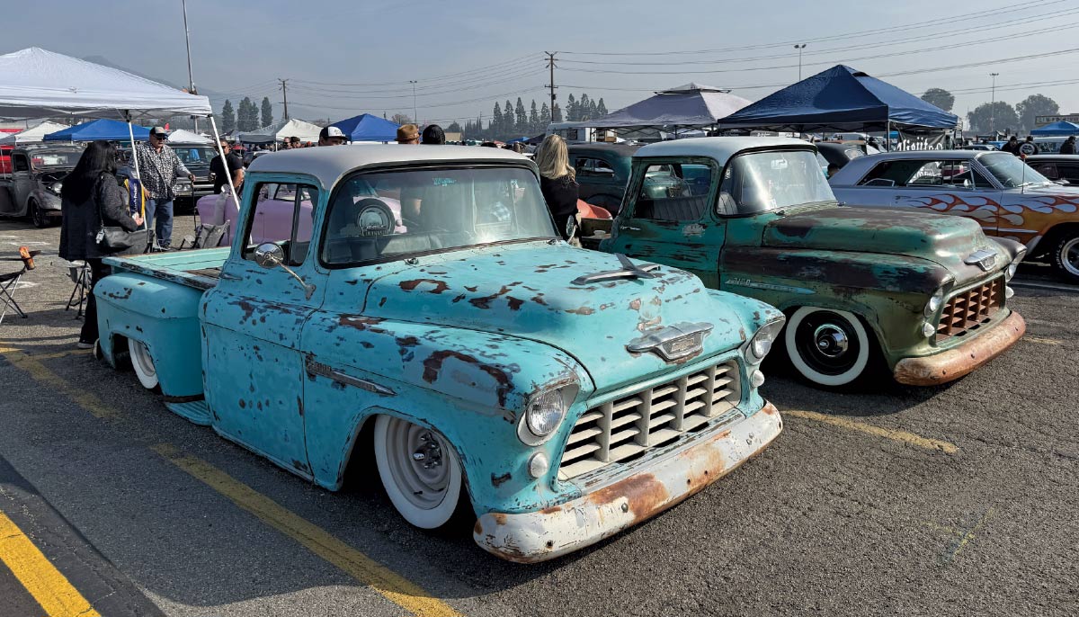 1955 Chevrolet 3100 turquoise patina lowered pickup and 1955 Chevrolet 3100 green patina classic truck pair car show