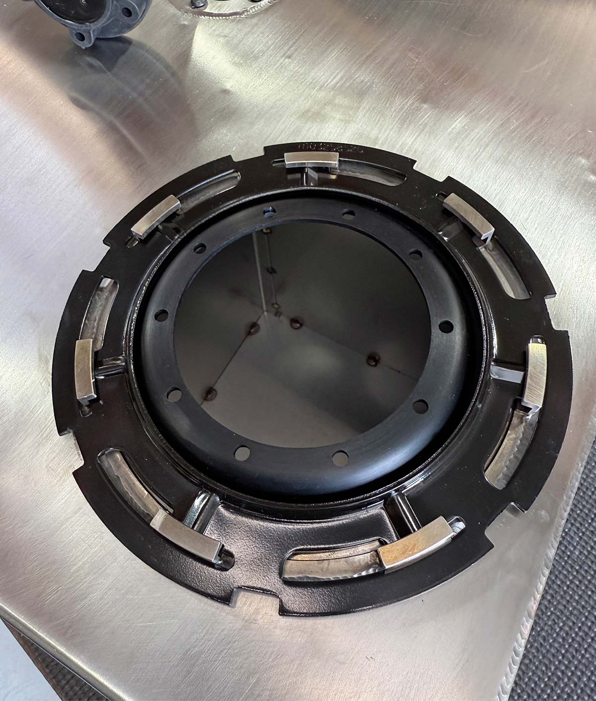 Close-up of the recessed fuel pump mounting ring and internal baffle.