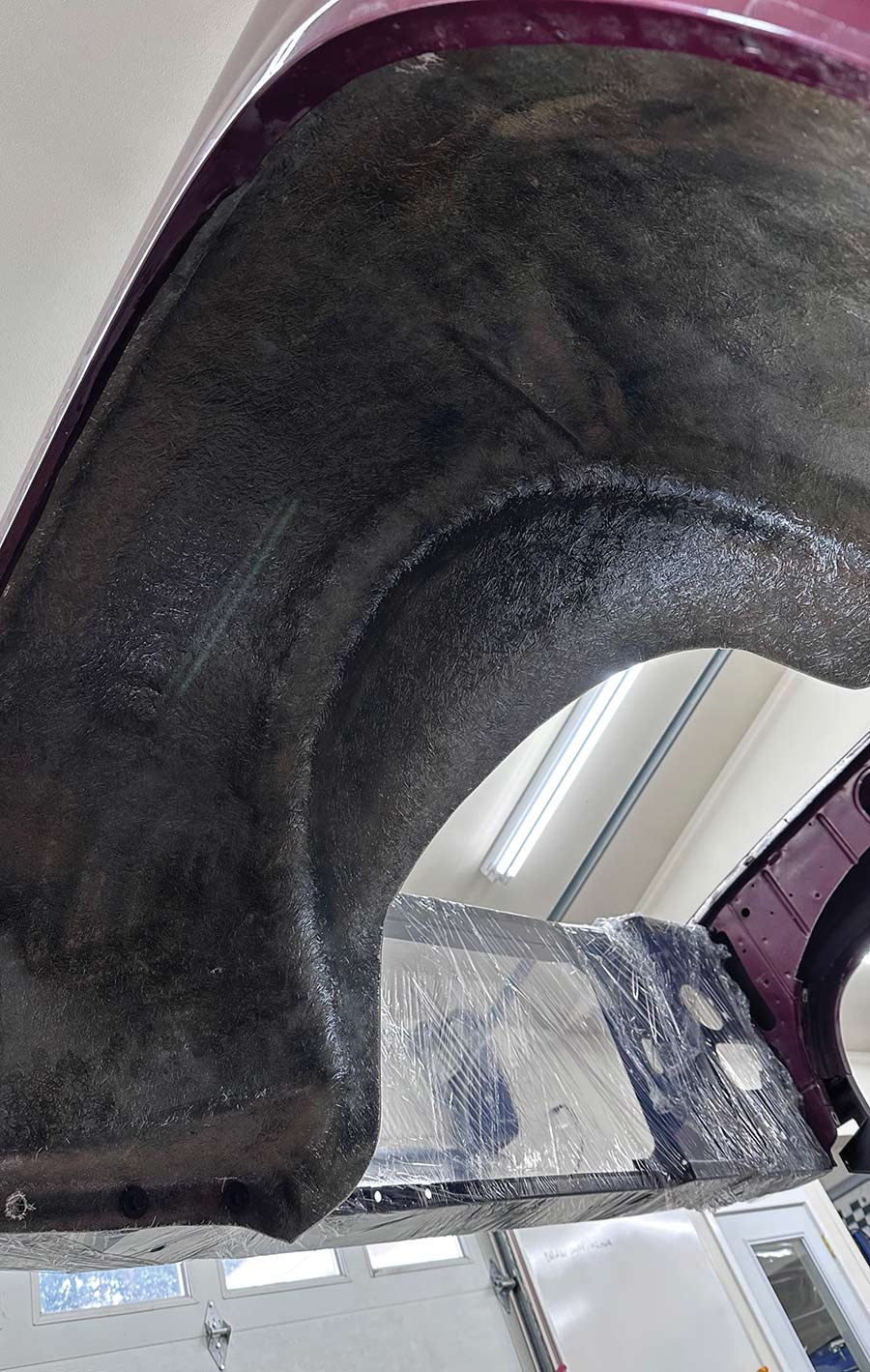 New Slosh Tubz fiberglass inner fender panel installed.