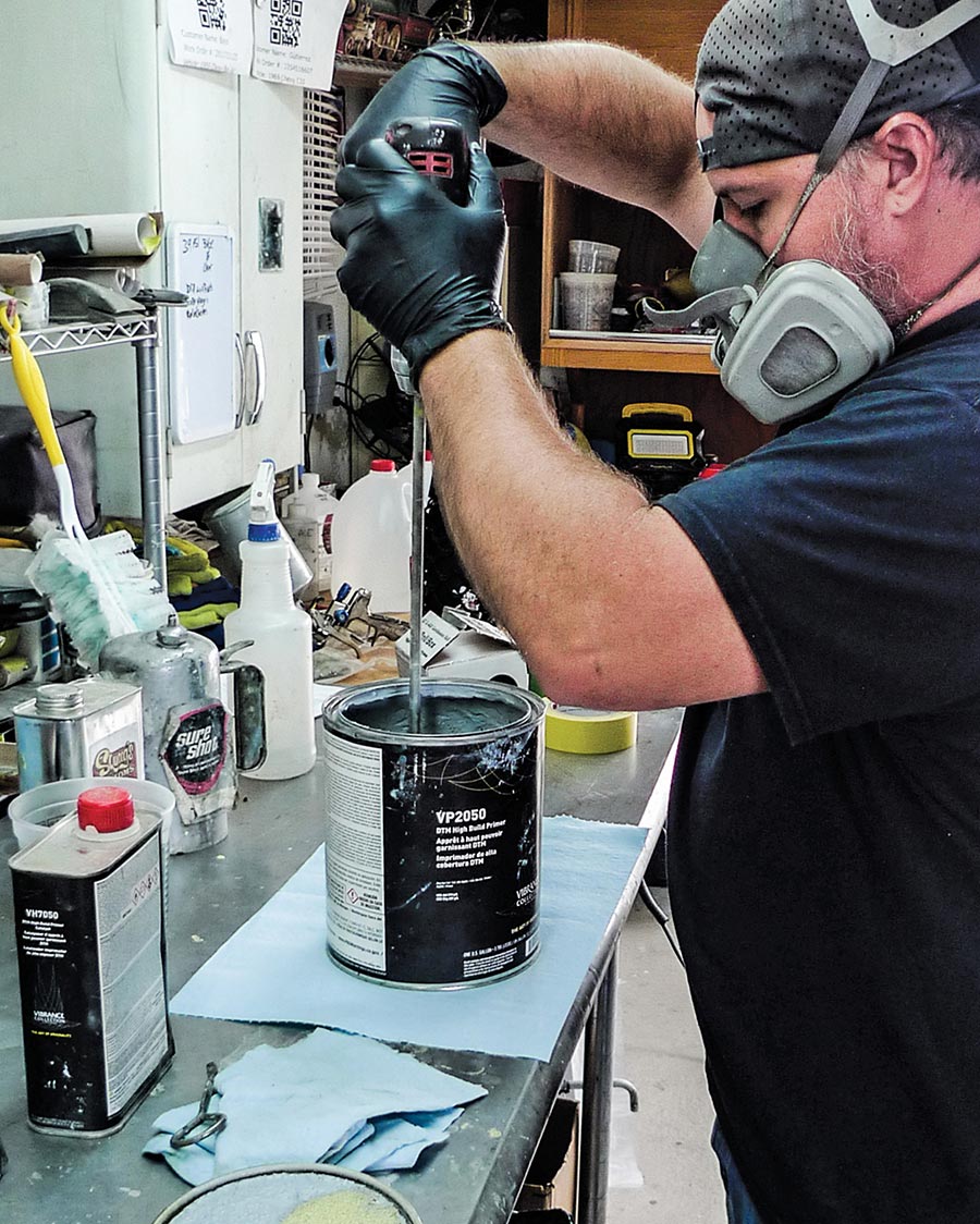 Mixing a can of epoxy primer for painting