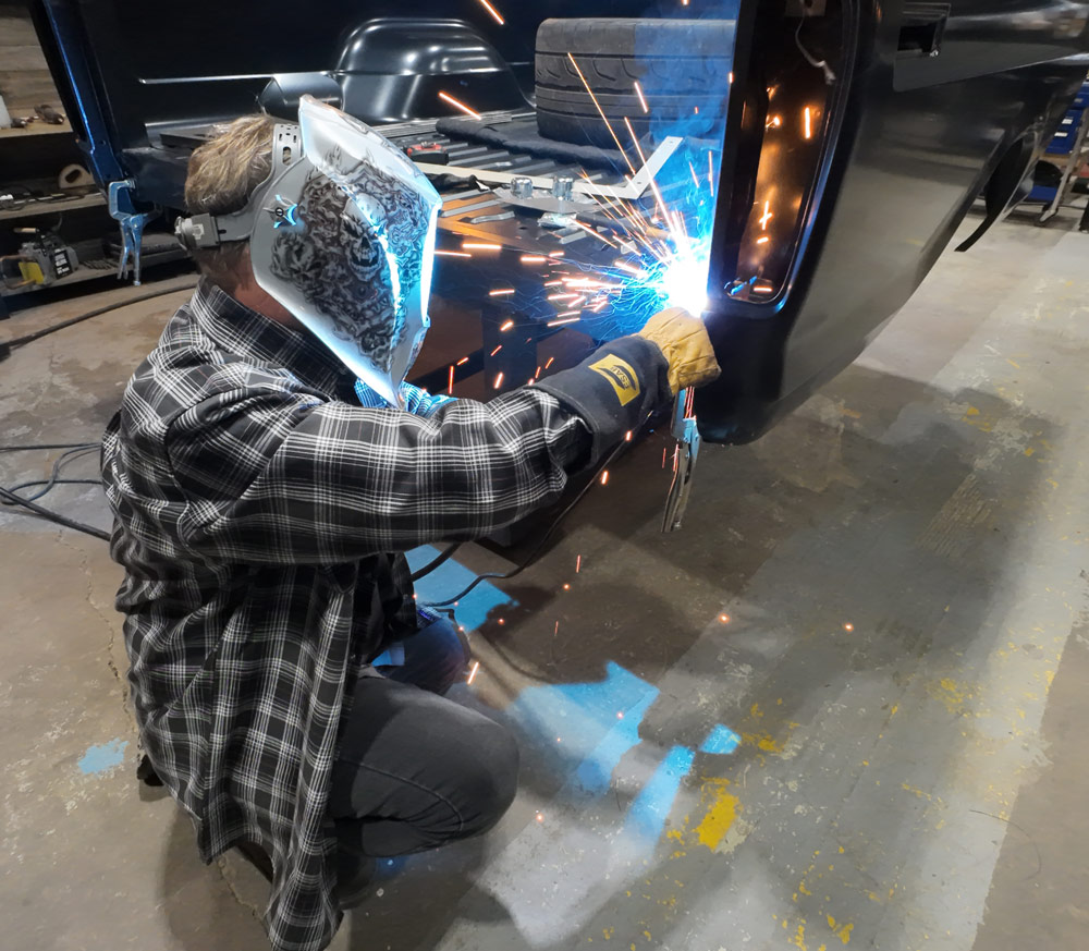 1978 Chevrolet C10 long bed MIG welding bedside seam, fabrication sparks detail