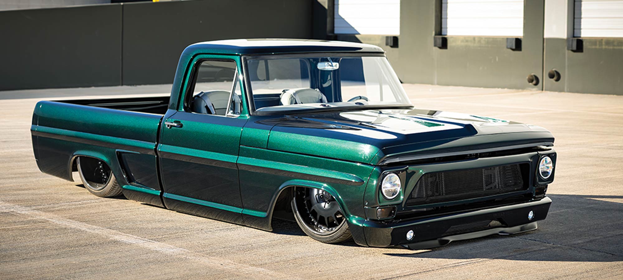 1967 Ford F100 custom lowered pickup metallic green paint blacked out grille air ride suspension