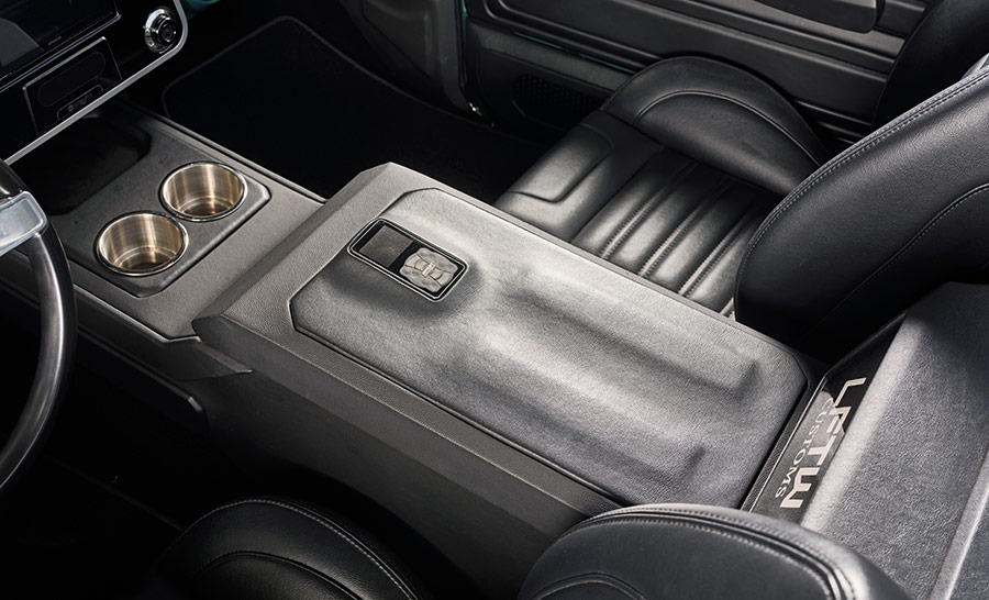 Custom leather center console with stainless cup holders