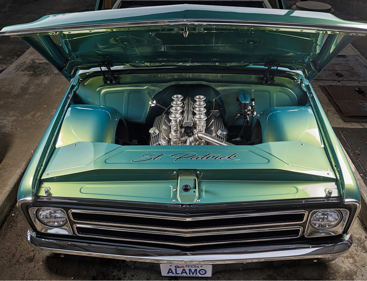 Clean engine bay featuring a vintage small-block Chevy with eight-stack induction