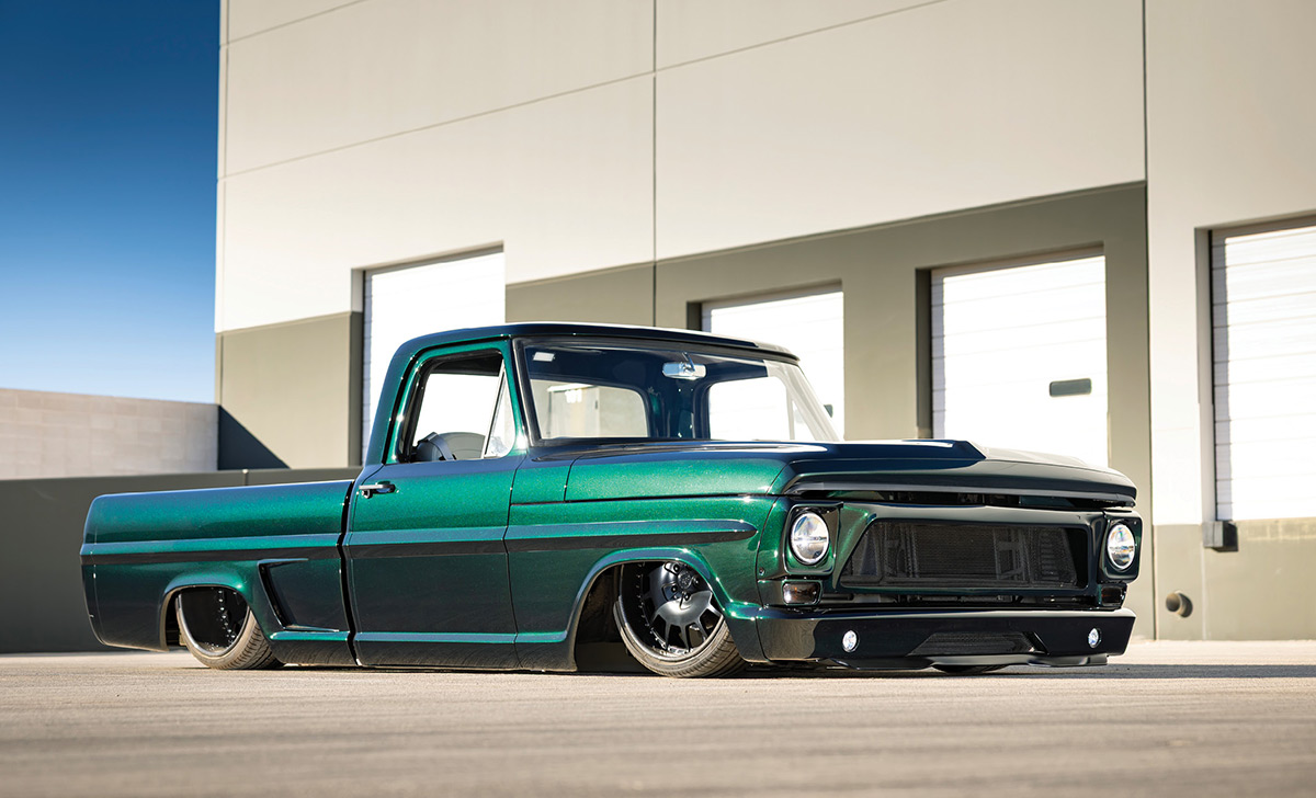 1967 Ford F100 custom lowered front three quarter view black mesh grille LED fog lights