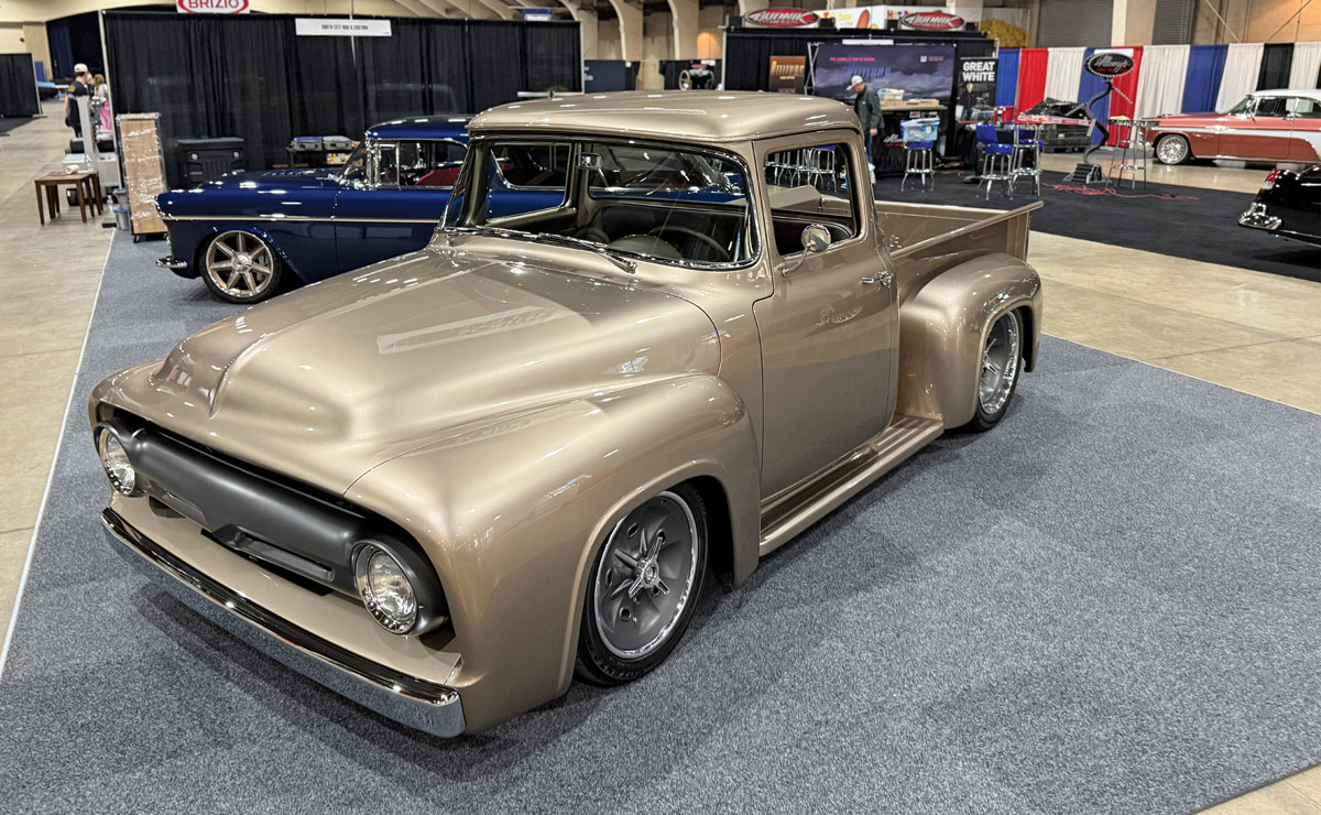 Tan 1956 Ford F100 on display.