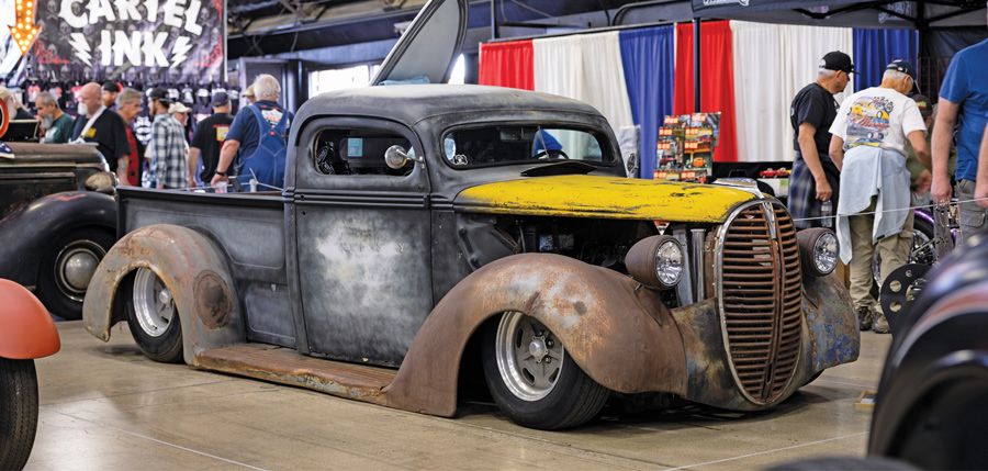 Slammed patina Chevrolet truck with yellow hood.