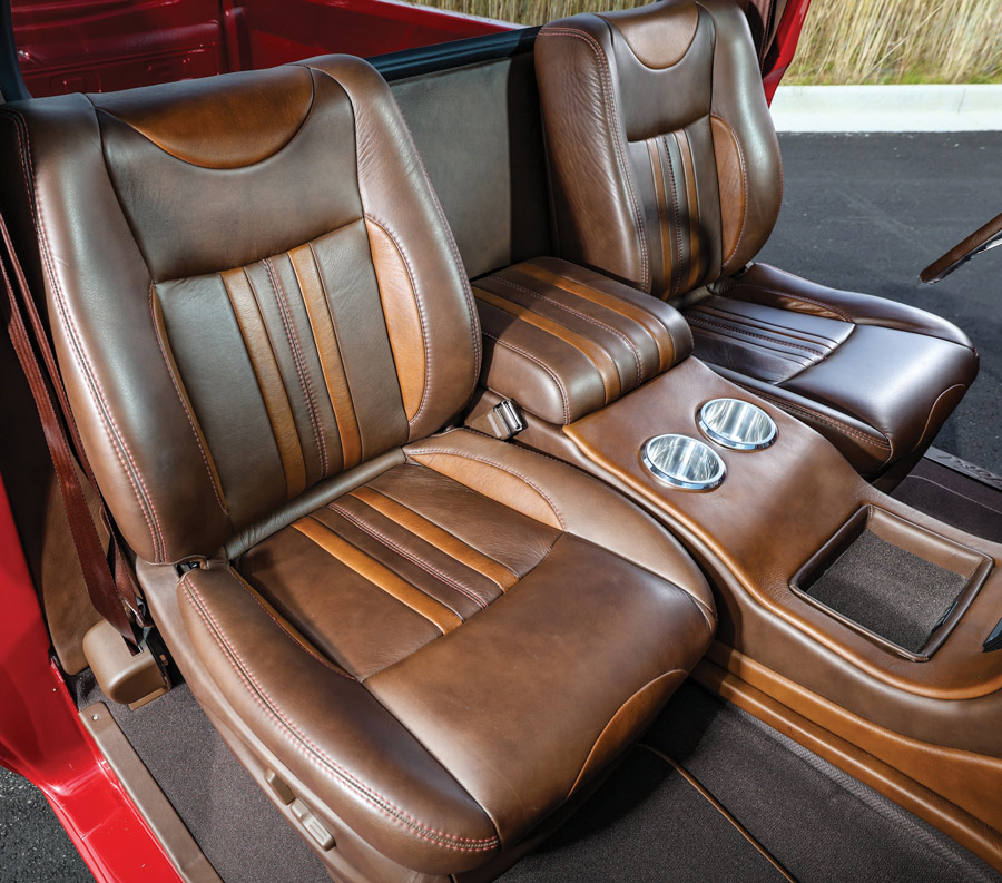 Reupholstered bucket seats and custom leather center console.