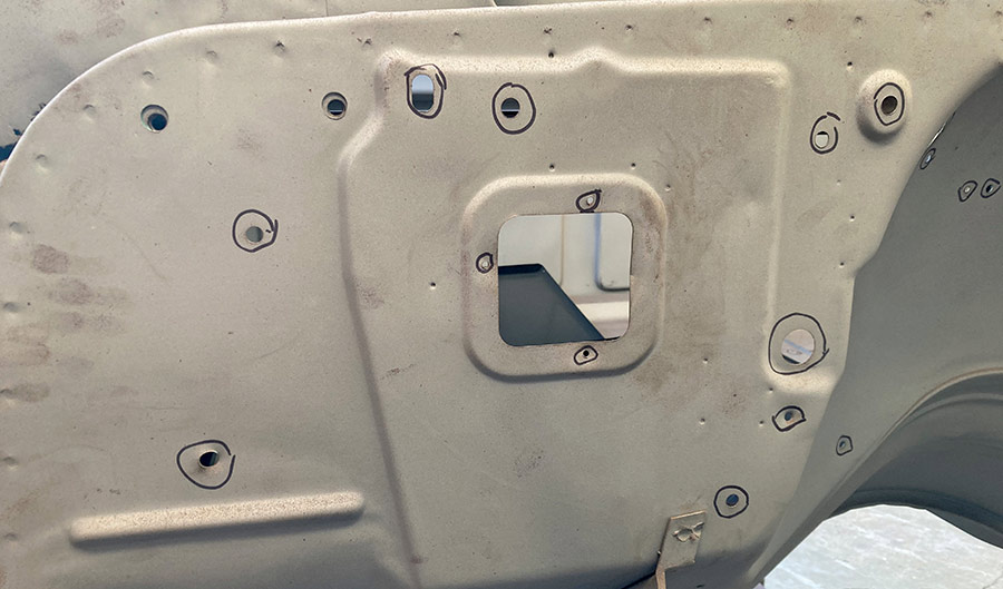 C10 firewall with circles marking holes to be filled