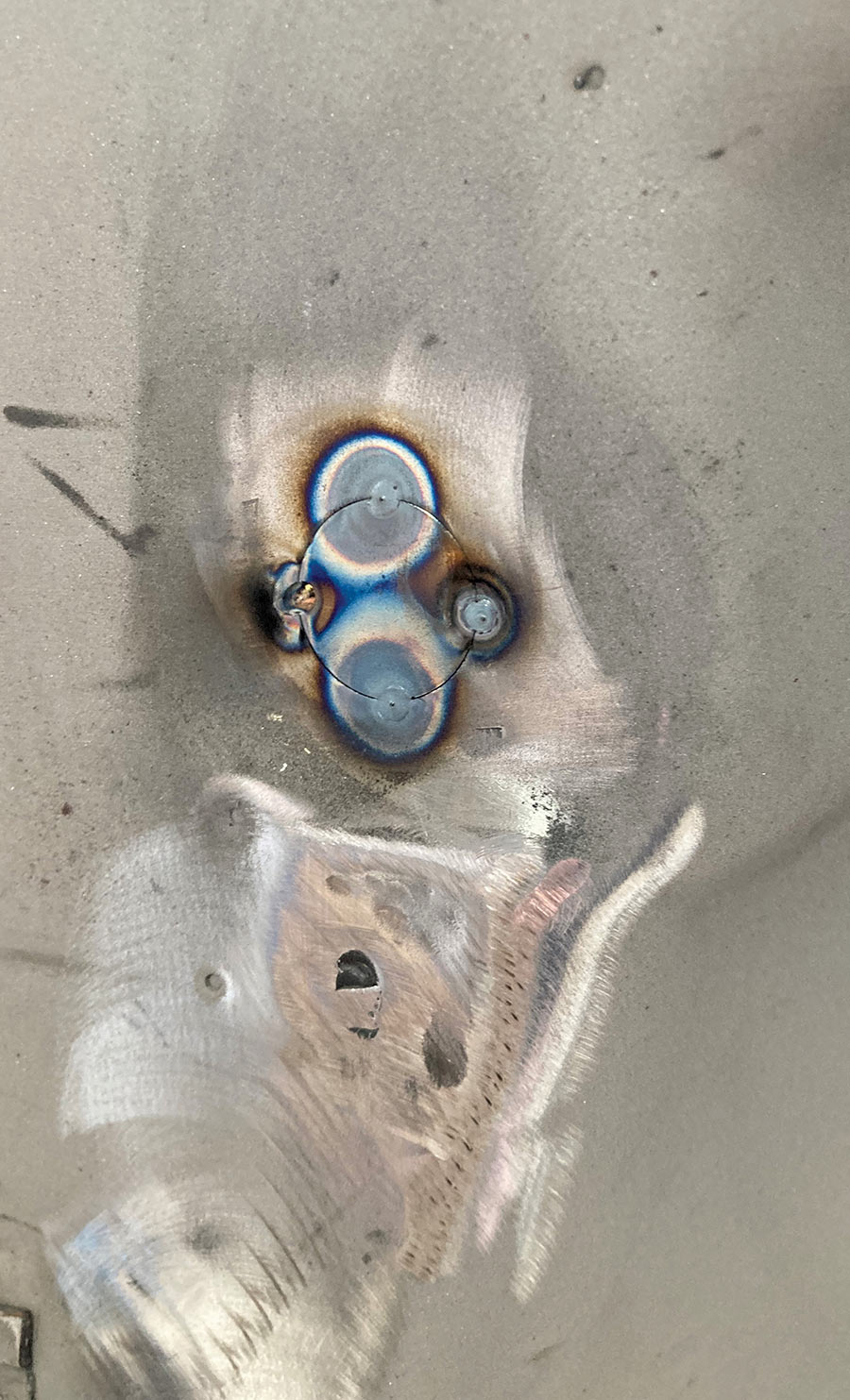 Filler disc being held by a magnet during tack welding