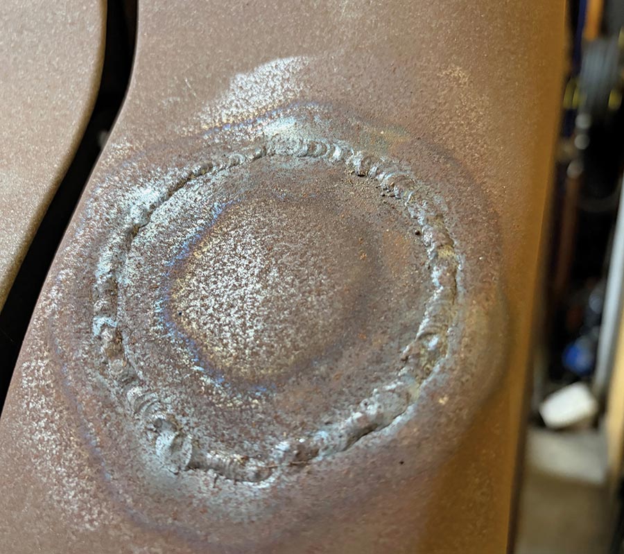 Close-up of surface rust appearing on a recent weld.