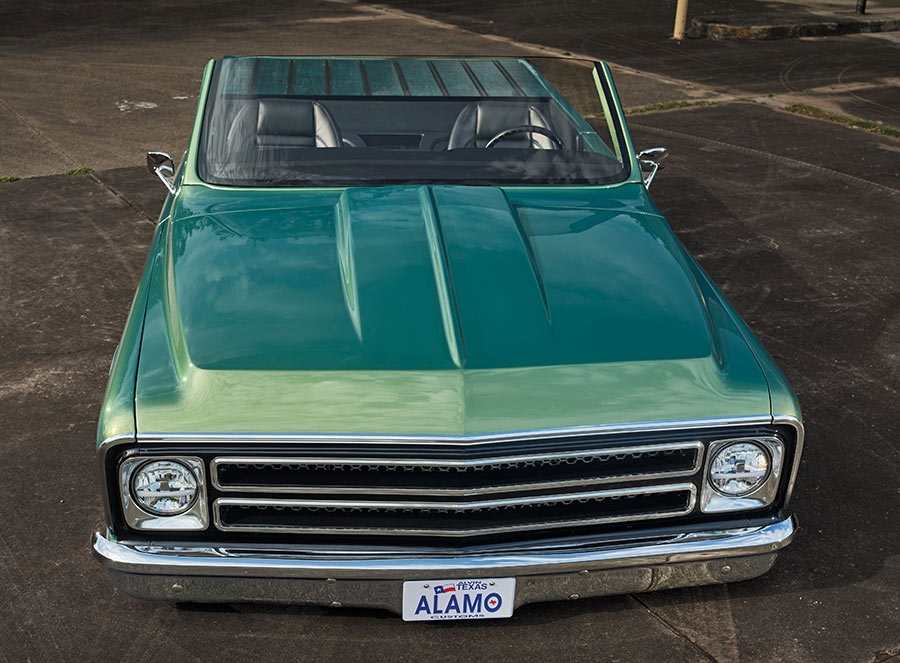 High angle front view of a custom teal classic truck