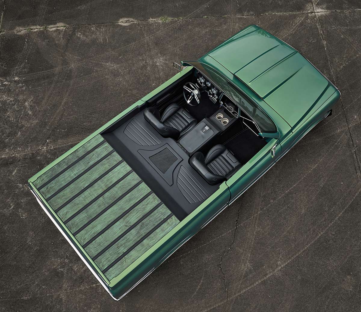 Overhead view showing the two-person cockpit and green wood bed