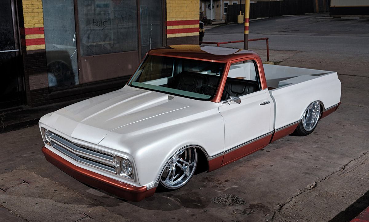 Low-angle front shot of white and copper 1968 Chevy Fleetside.
