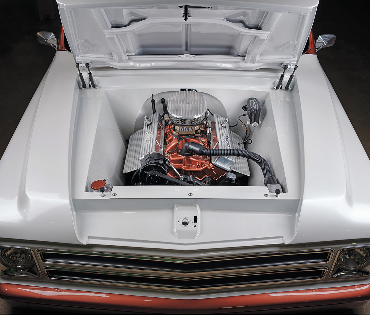 Engine bay featuring detailed 350 small-block Chevy with copper paint.