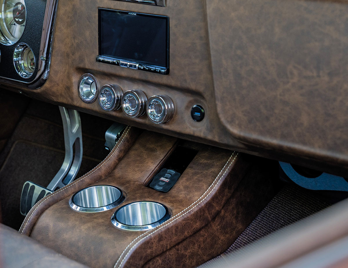 Custom center console featuring cup holders and modern touchscreen.