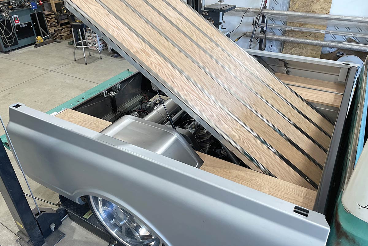 Oak wood slats being installed in the truck bed