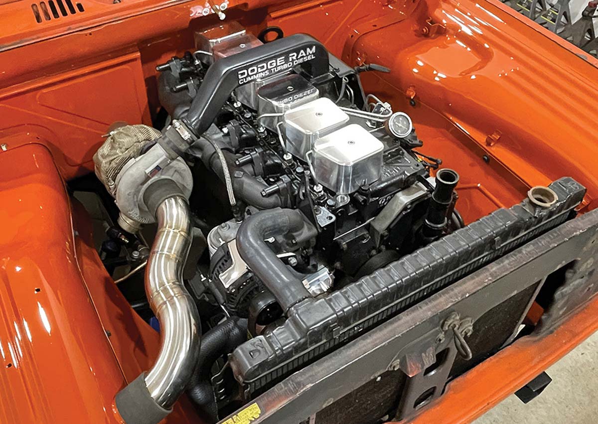 Cummins 5.9L turbo diesel engine in an orange bay