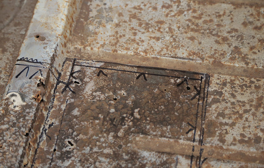 Marked cut lines on the original floor for patching.