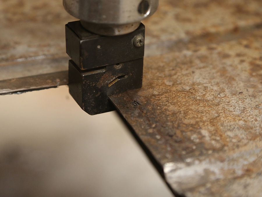 Creating a flange on sheetmetal using a flanging tool.
