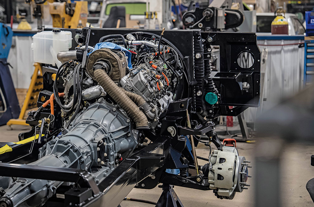 Turbocharger nestled between engine cylinder banks.