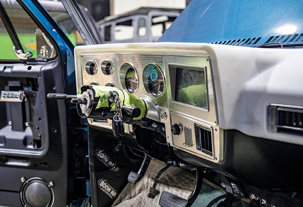 Trial fitting custom-built instrument cluster in dash.