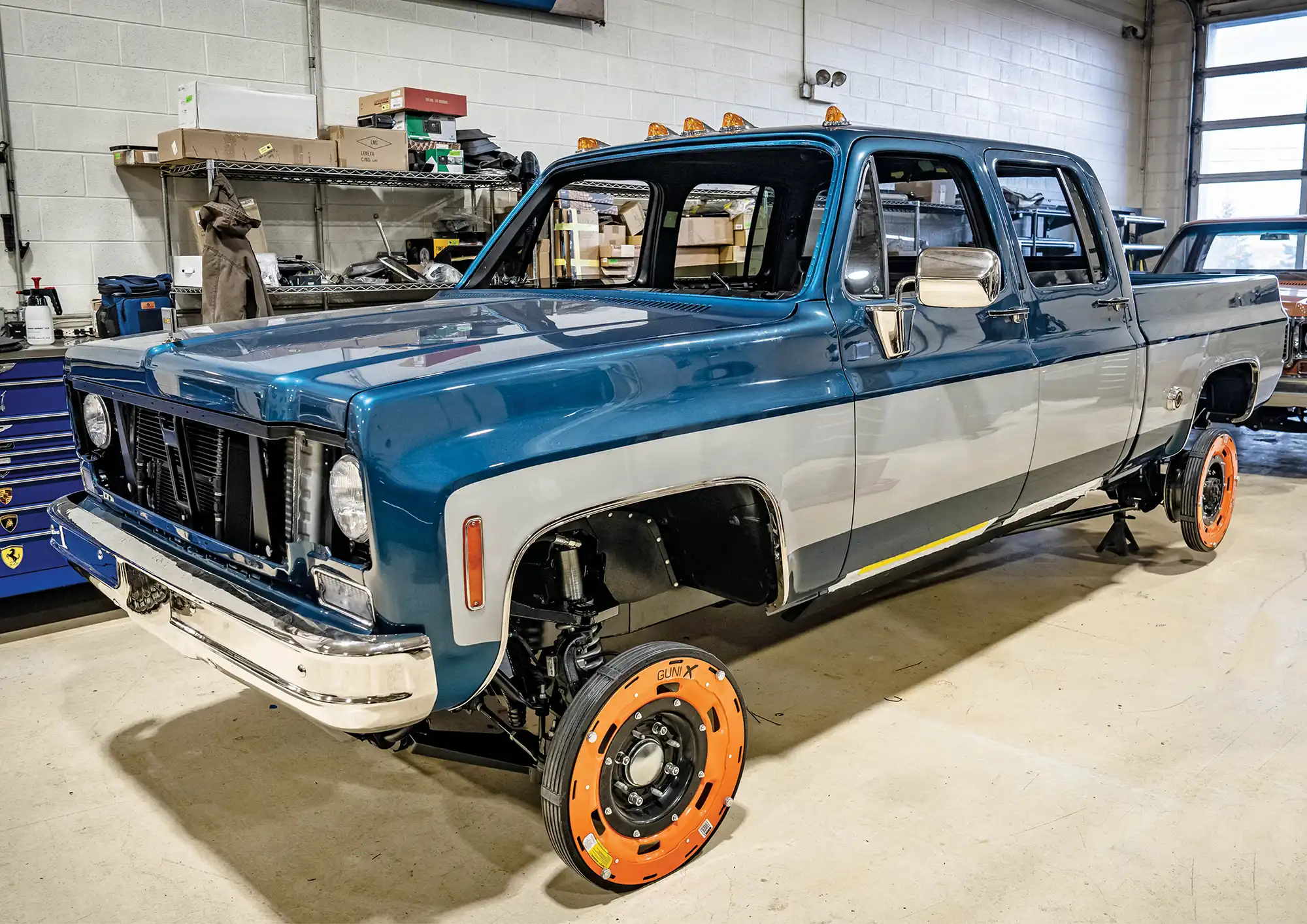 Blue and silver two-toned squarebody crew cab.