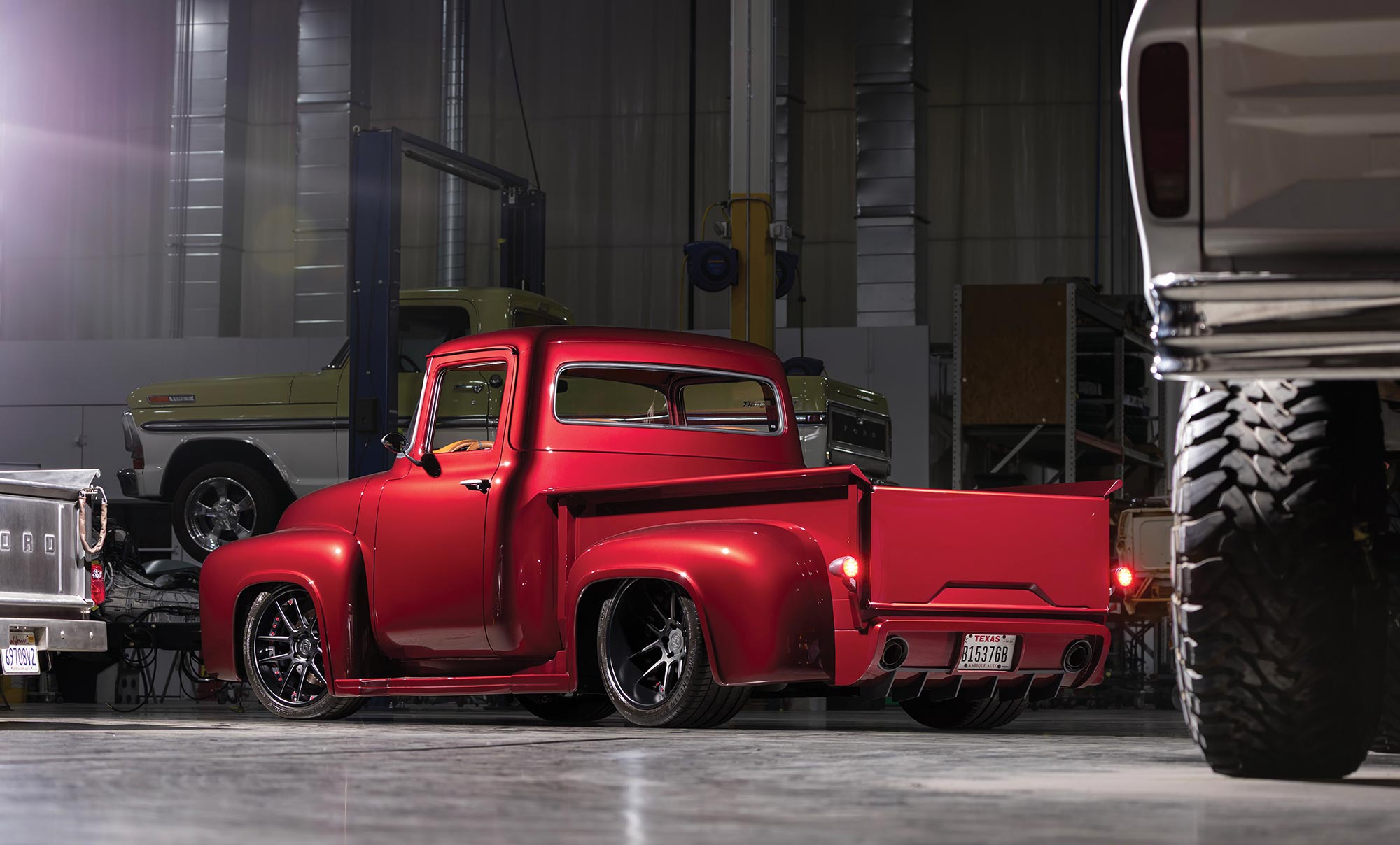 Rear view of the red F-100 showing custom rear diffusers.