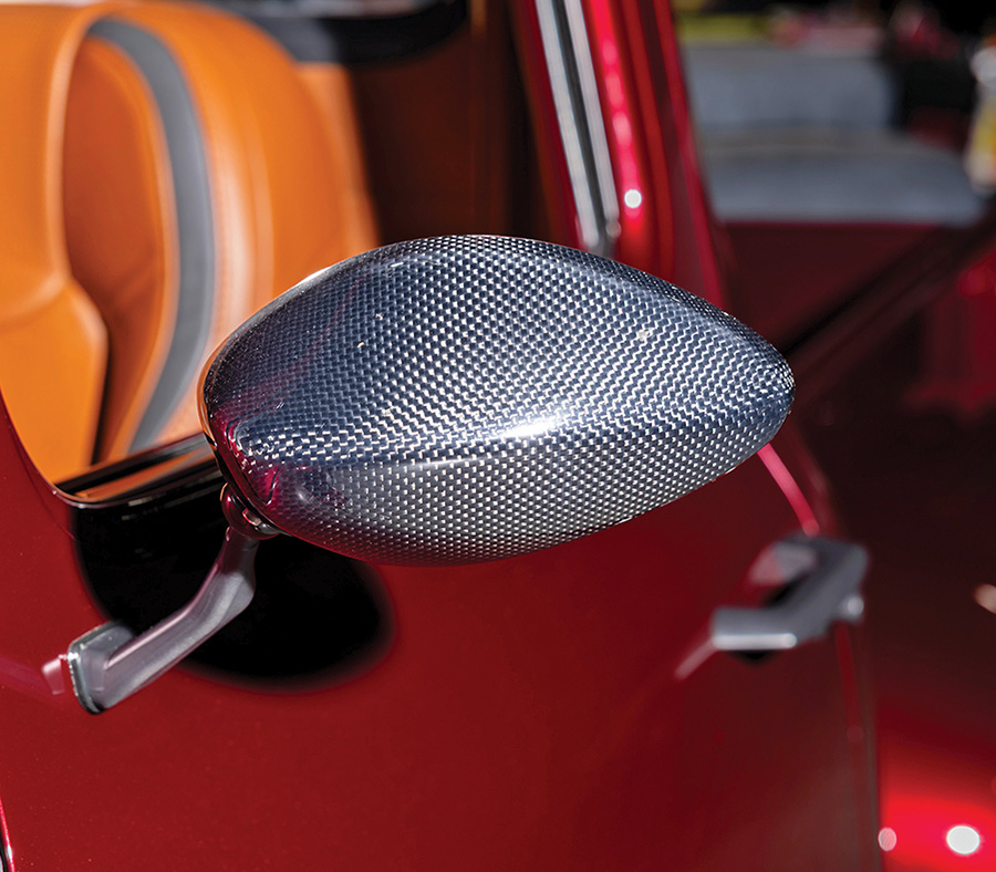 Close-up of the carbon-fiber side mirror on the red truck.
