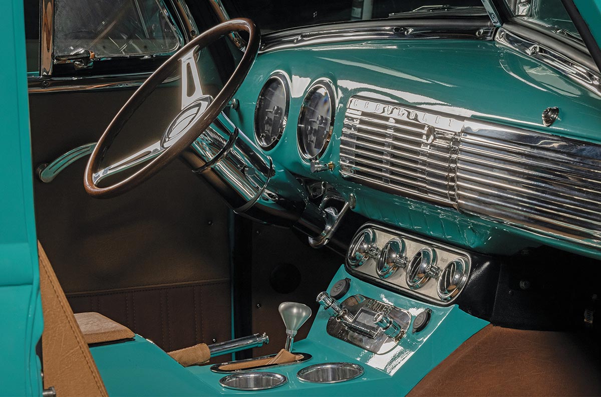Dashboard detail through an open driver side door.