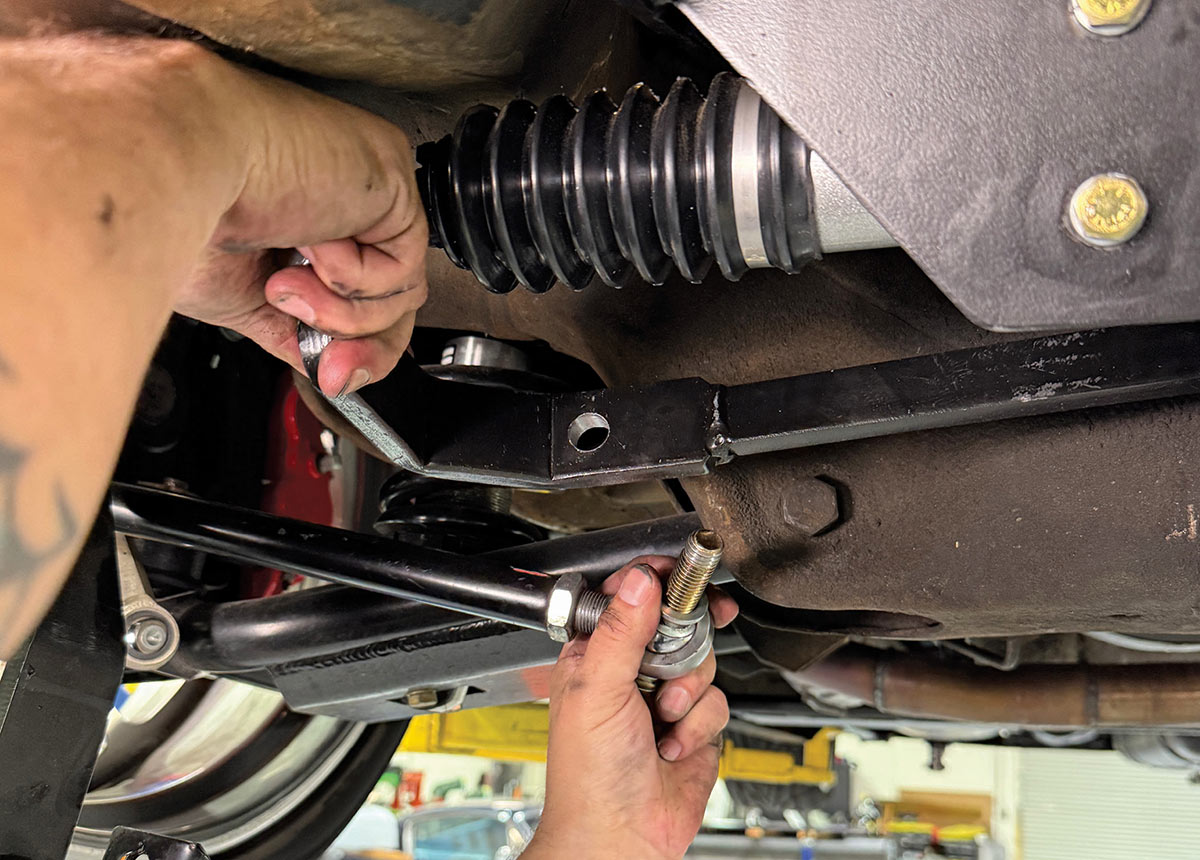 Connecting steering linkage to the travel bar.