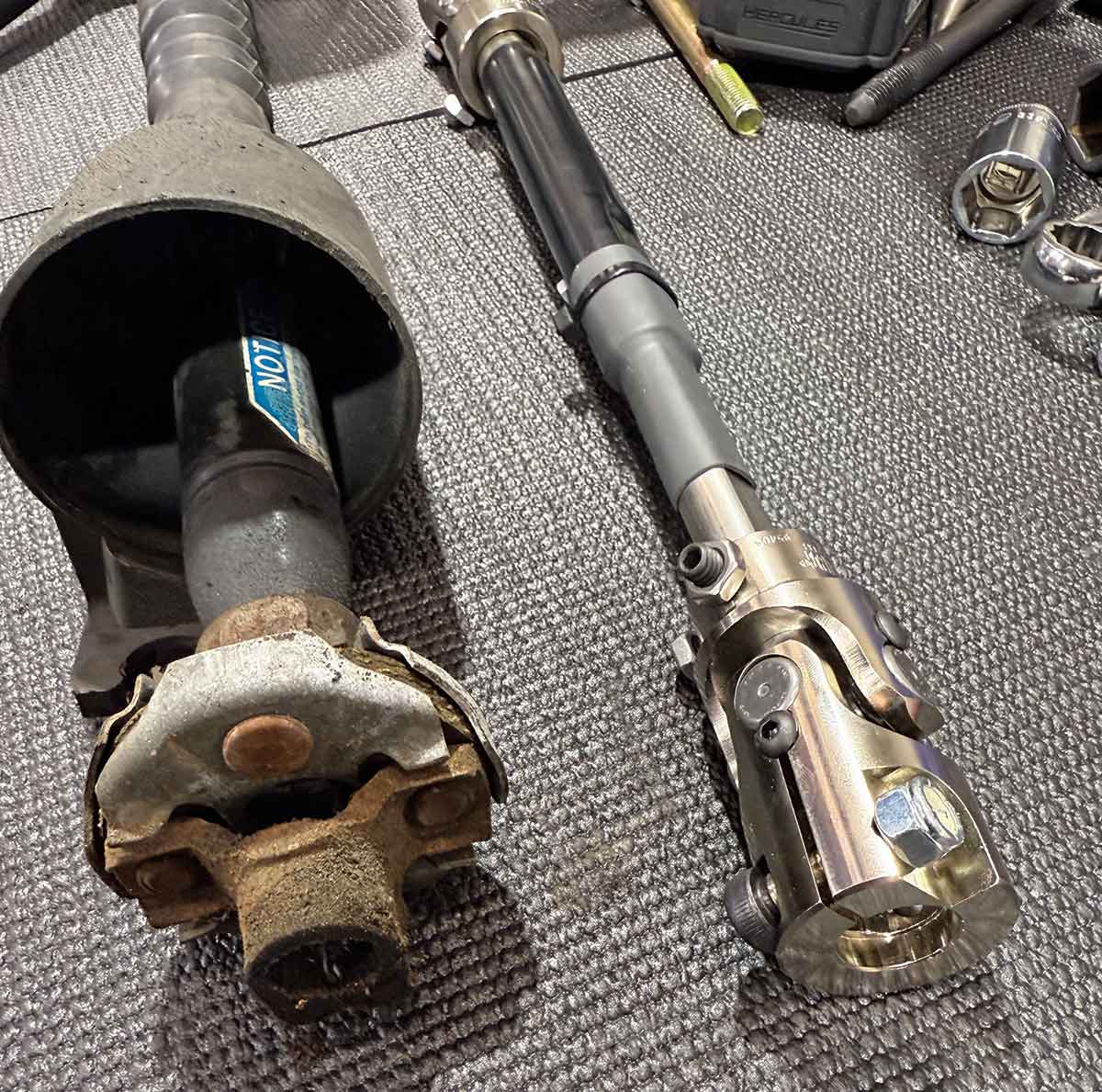 Factory rag joint compared to new stainless U-joint.