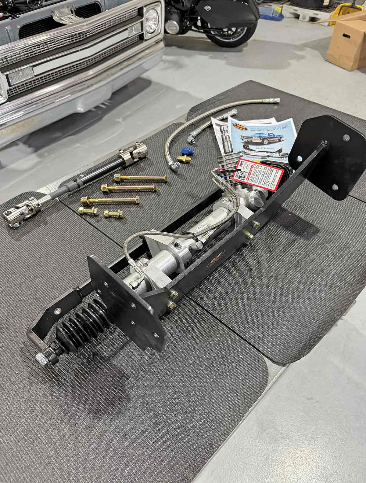Unboxed rack-and-pinion conversion kit with hardware.