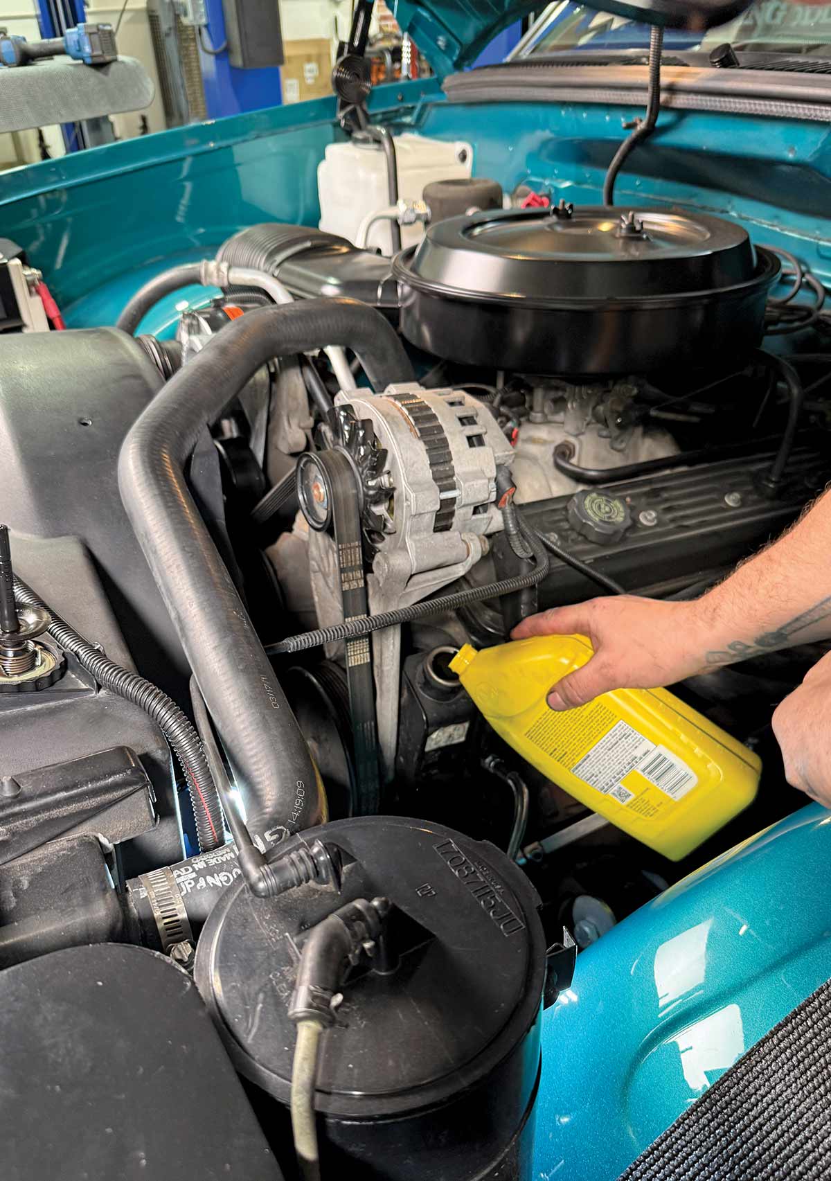 Topping off and bleeding the power steering reservoir.