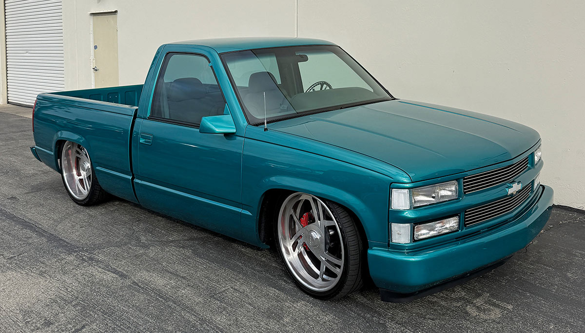Green 1995 Chevy OBS truck parked after installation.