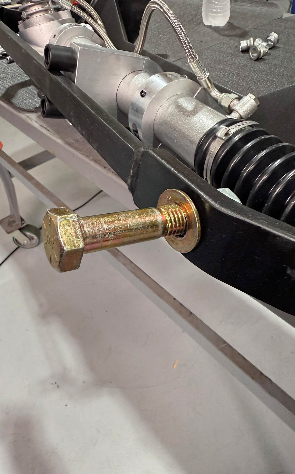 Drilling out tapered holes on the travel bar.