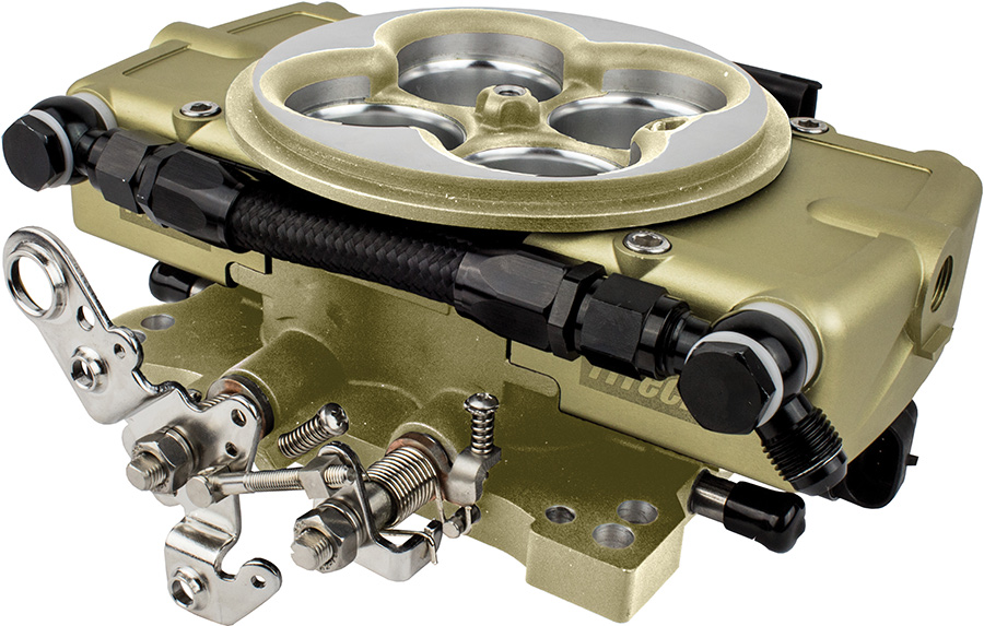 Close-up of a gold-finished FiTech throttle body injection unit.
